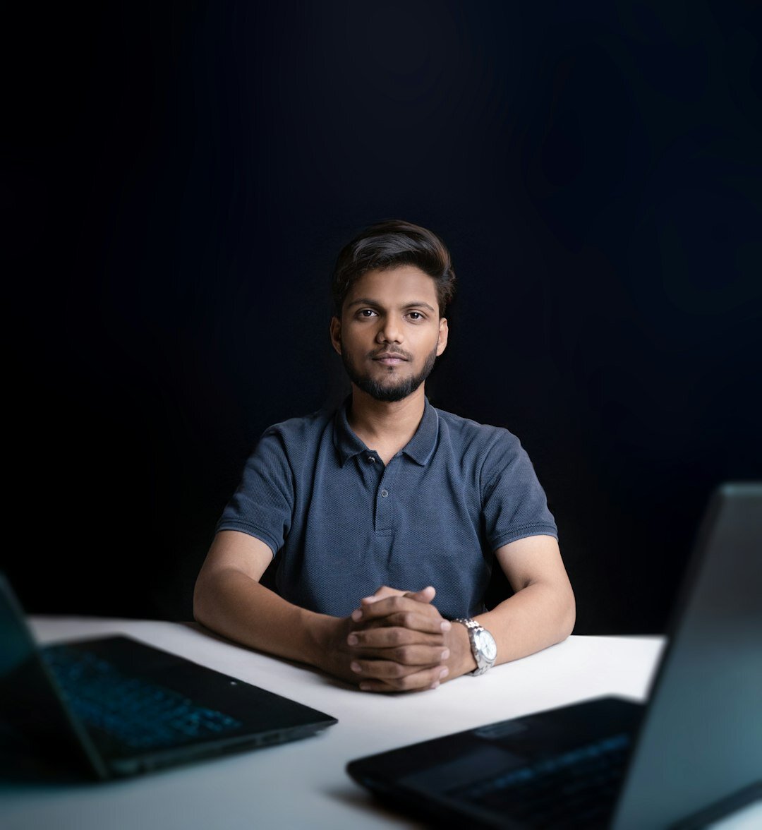 Studio portrait of a Belgian man content and SEO specialist with glasses